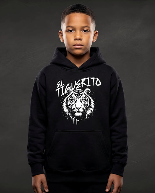 Child wearing a black hoodie with a tiger graphic and text on a dark background