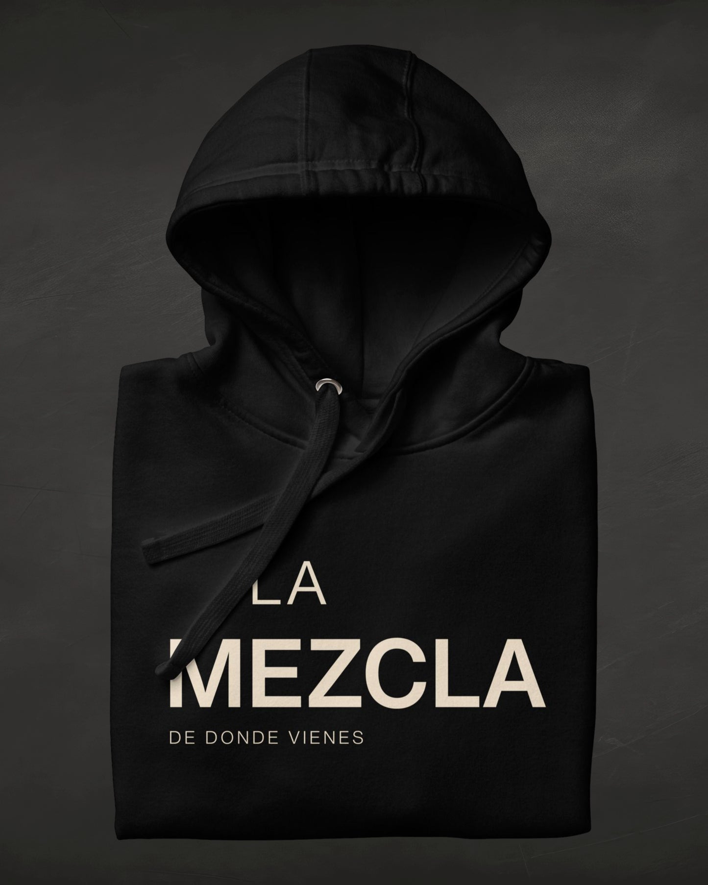 Black hoodie with 'La Mezcla' text on a dark background