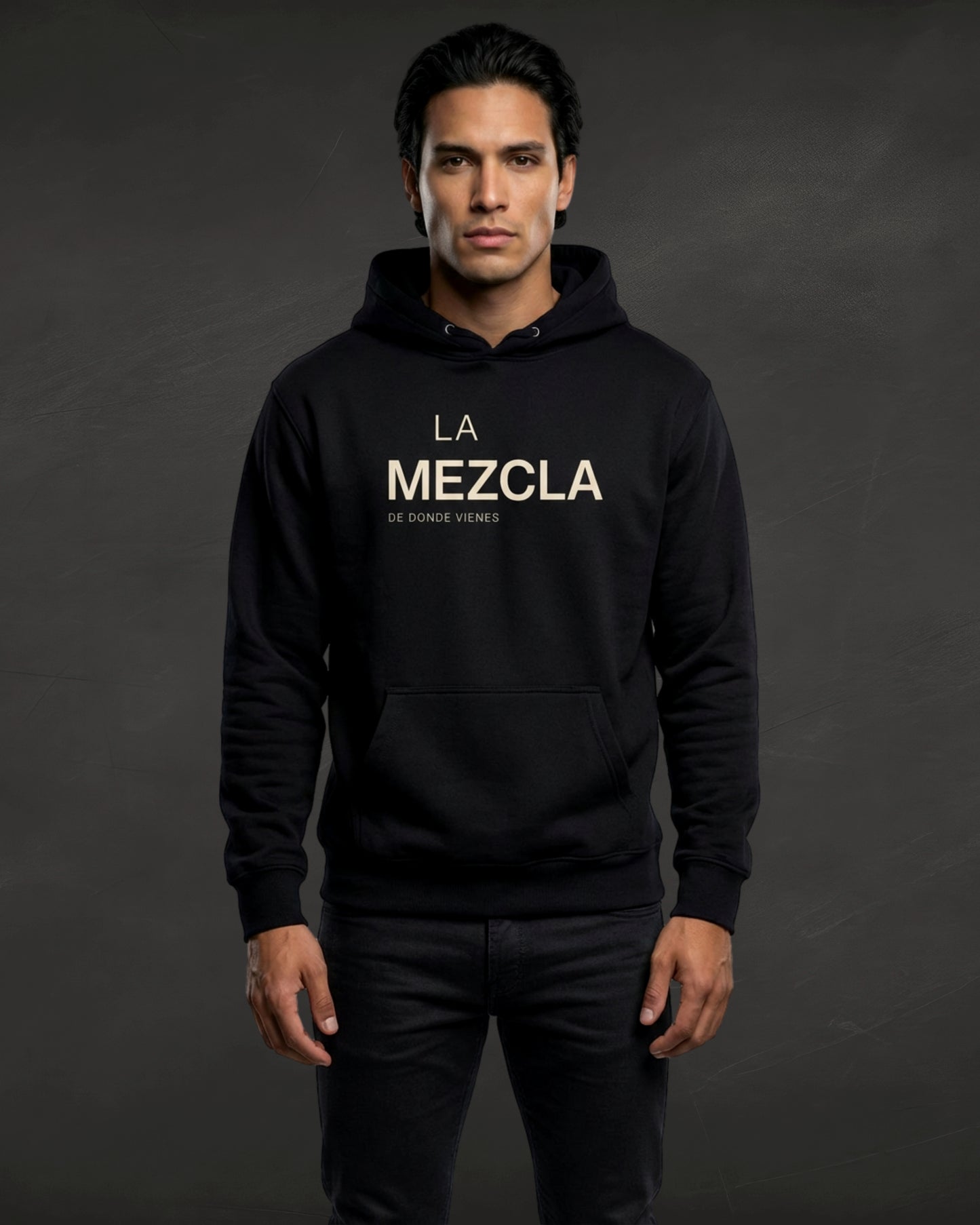 Person wearing a black hoodie with 'La Mezcla' text on a dark background