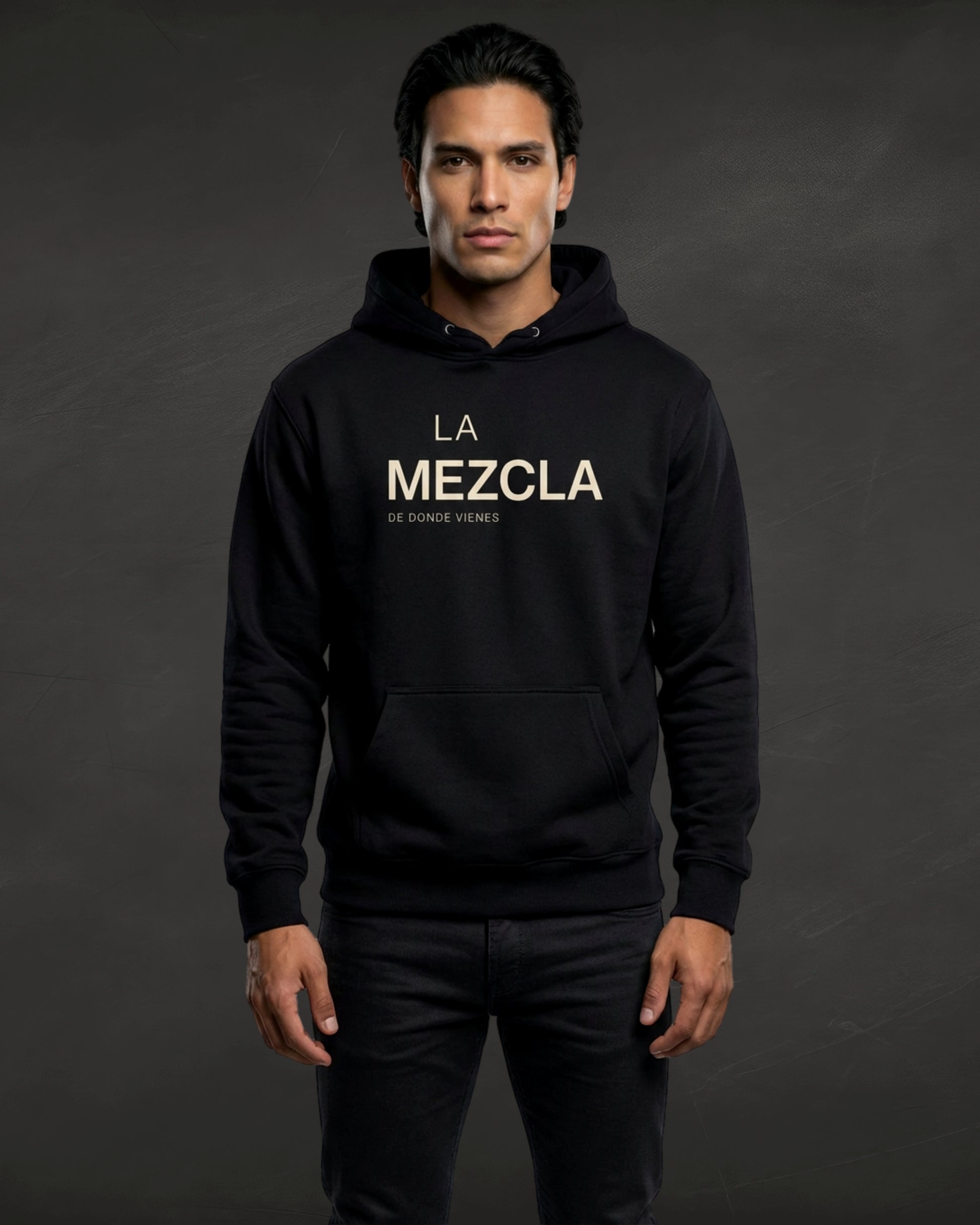 Person wearing a black hoodie with 'La Mezcla' text on a dark background