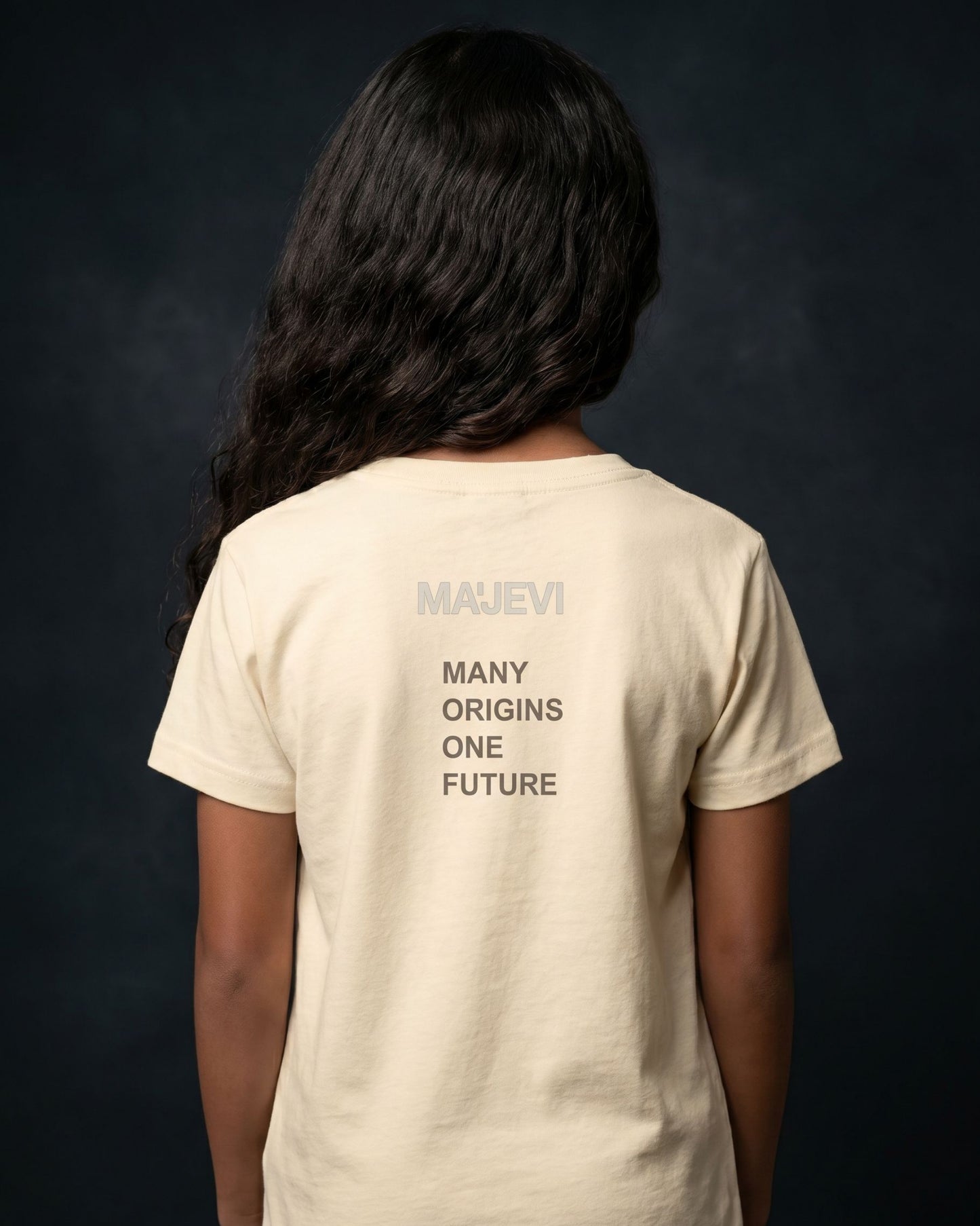Person wearing a beige t-shirt with 'MAUVEI' branding and text on the back against a dark background