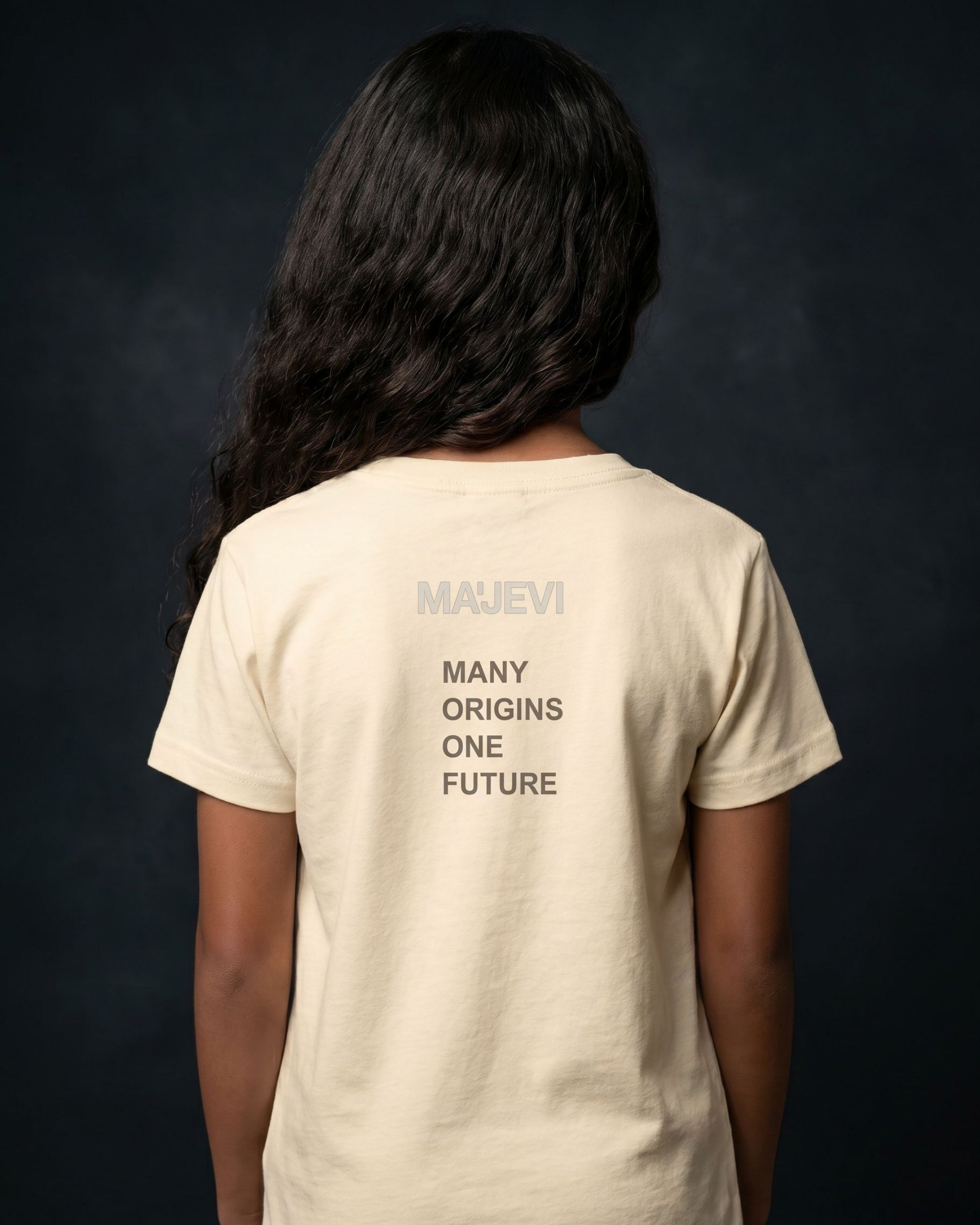 Person wearing a beige t-shirt with 'MAUVEI' branding and text on the back against a dark background