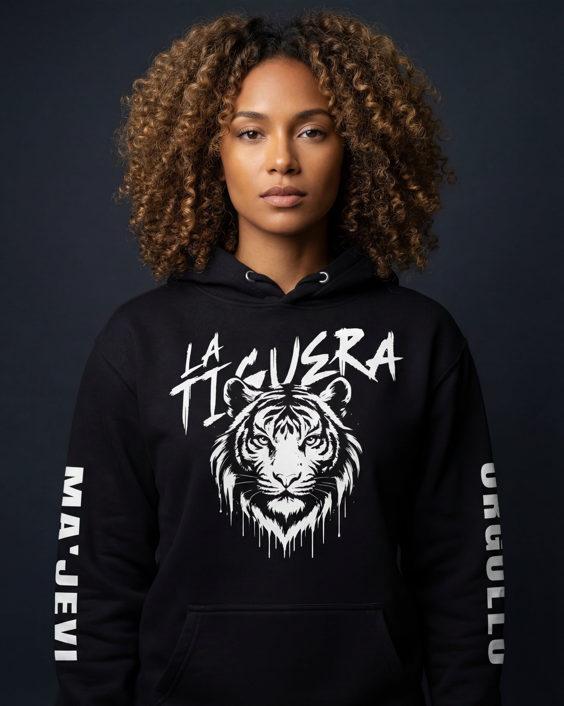 Person wearing a black hoodie with a tiger graphic and text on a dark background