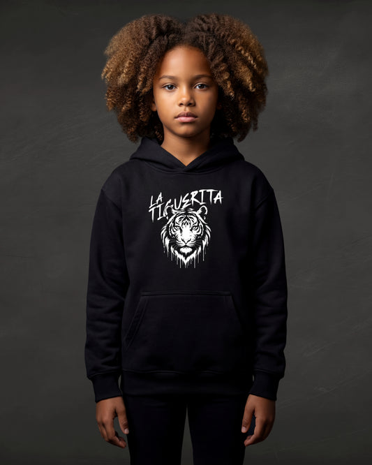 Child wearing a black hoodie with a tiger graphic and text on a dark background