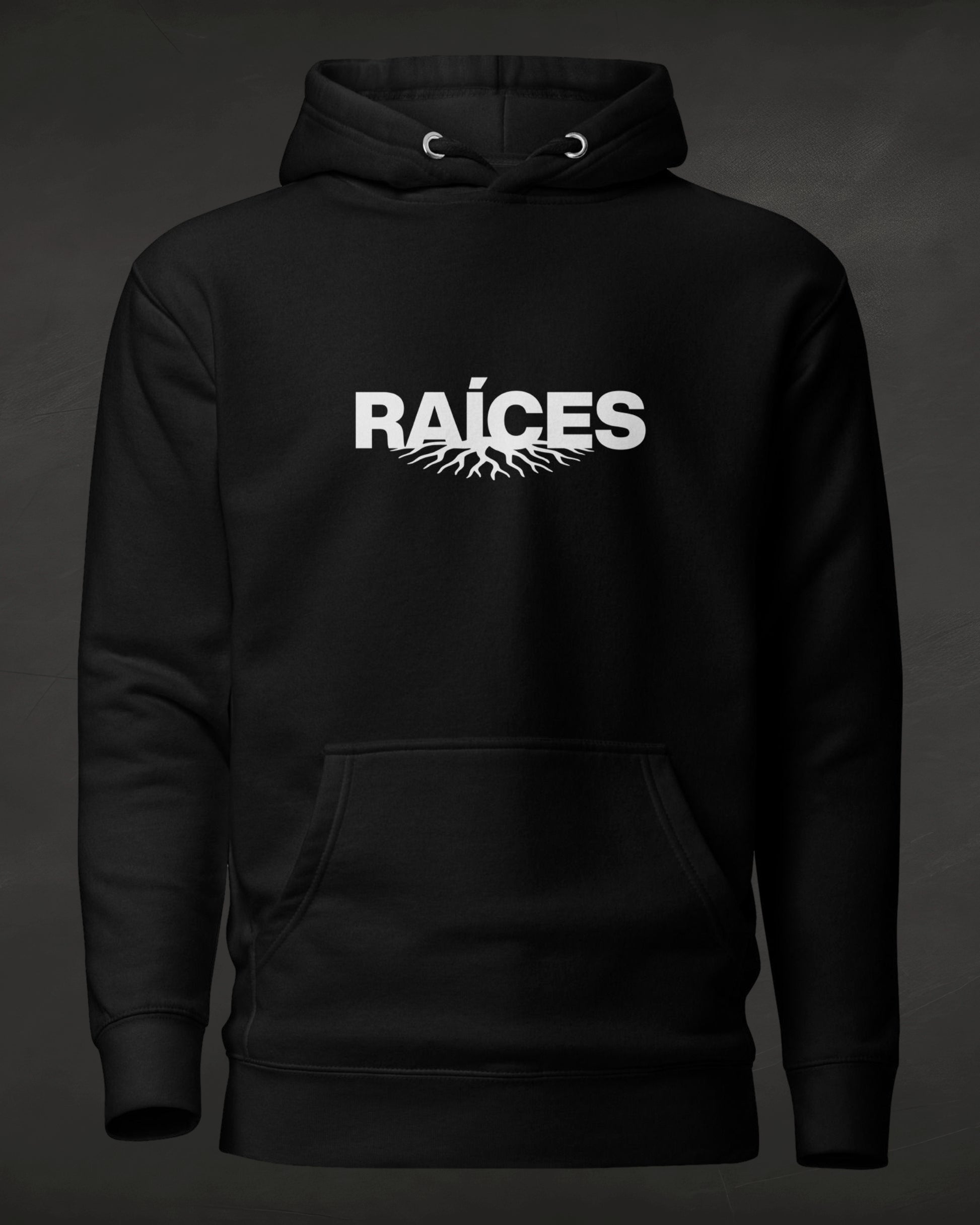 Black hoodie with 'RAÓCES' text on a dark background